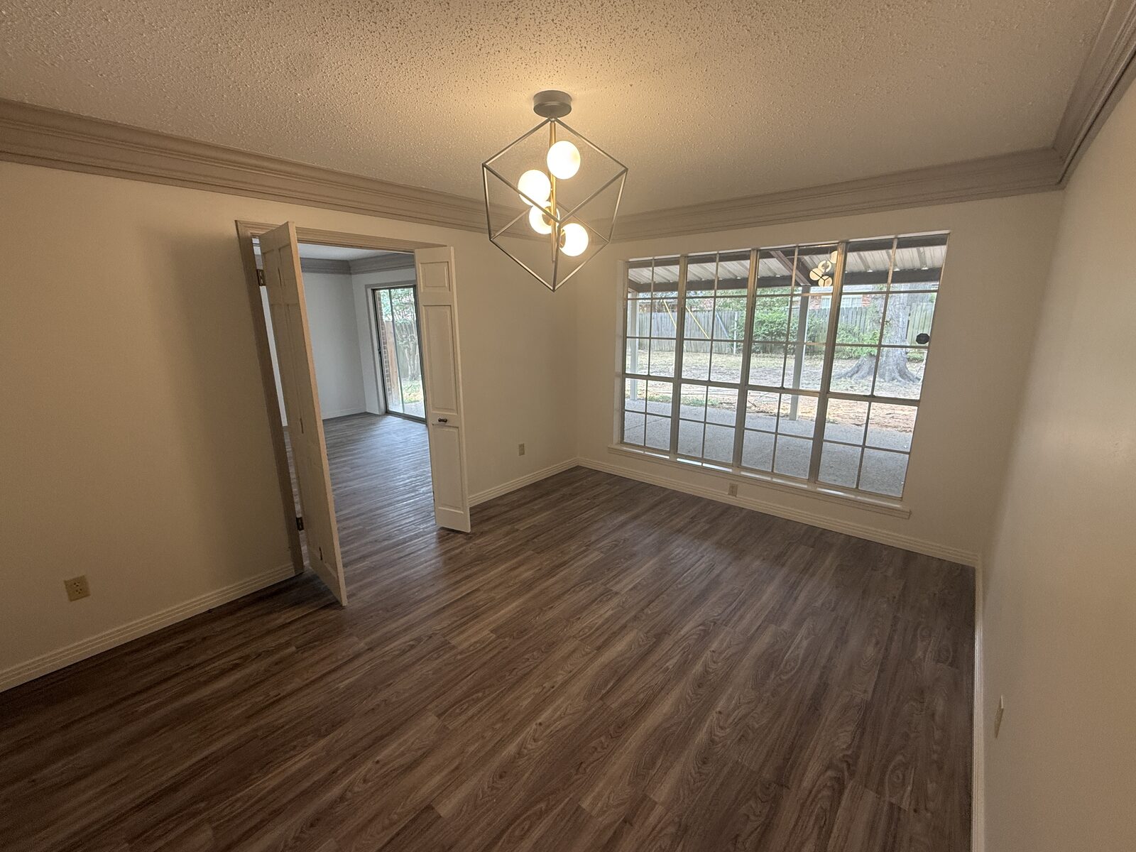 Dining room with modern light fixture