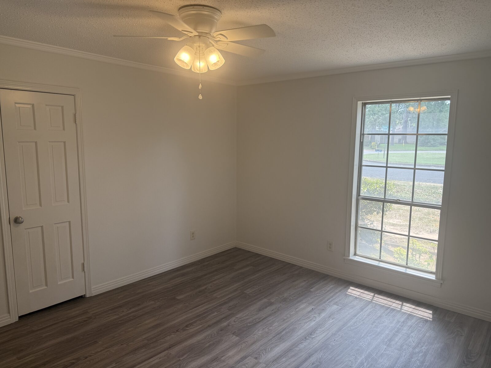 Bedroom with ceiling fan and window