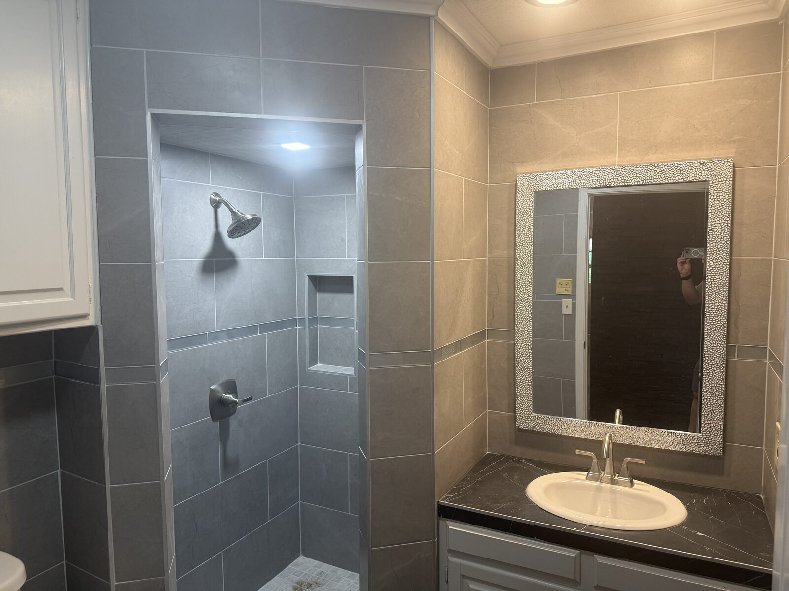 Full bath with tiled walk-in shower